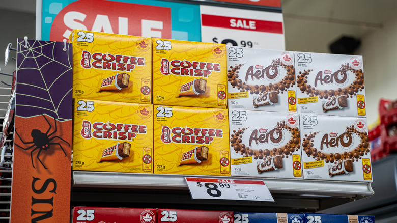 View of Nestle Coffee Crisp and Aero chocolate boxes on sale display.