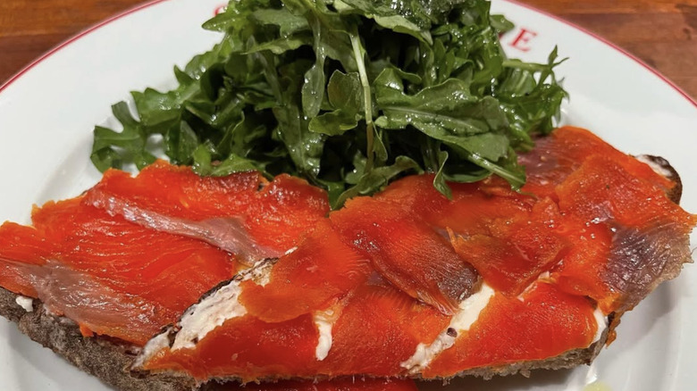 Lox on toast with arugula on the side