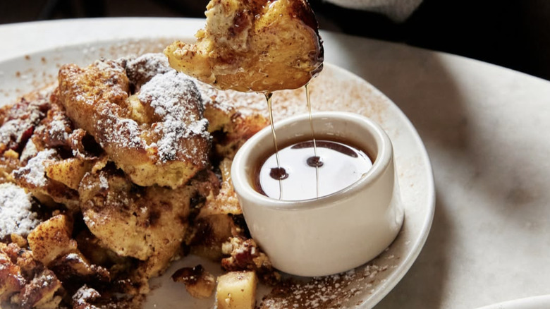 Apple panenata dipped into maple syrup from Mioposto Seattle brunch