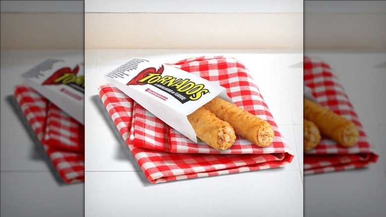 Two Tornados in paper wrapper on checkered red napkin