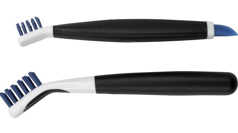 Two OXO deep clean crevice brushes