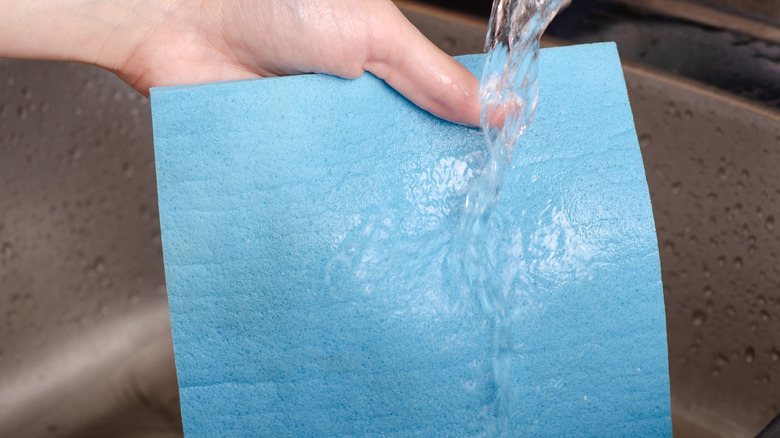 Hand washing a blue Swedish cleaning cloth