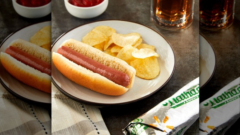 Nathan's Famous Hot Dog on a plate with potato chips