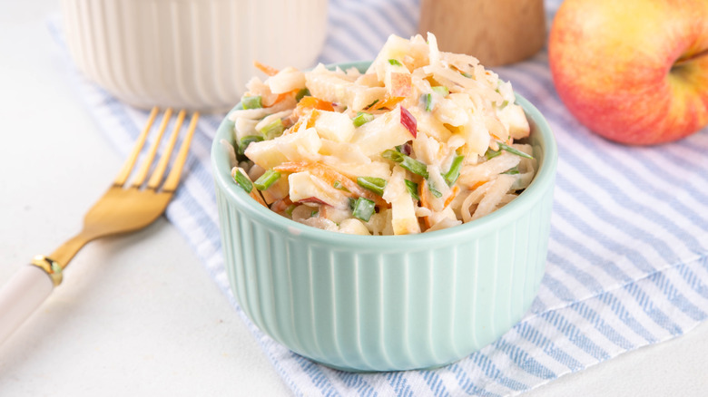 Apple slaw in small blue bowl