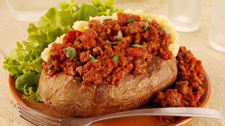 Baked potato topped with Bolognese sauce
