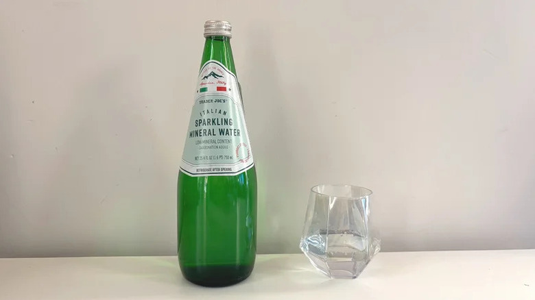 Bottle of Italian Sparkling Mineral Water next to glass