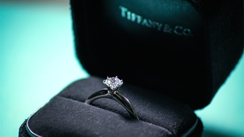 Tiffany-style diamond engagement ring in a Tiffany & Co. box