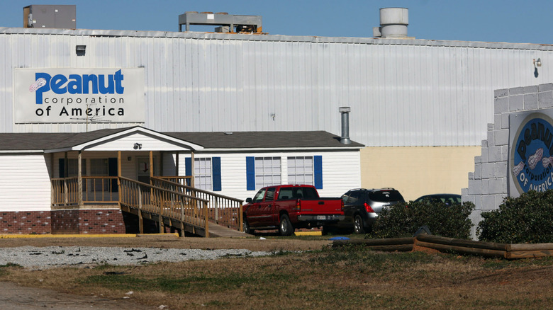 vehicles parked outside of a Peanut Corporation of America production facility