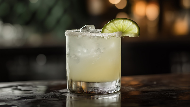margarita with lime wedge on a bar
