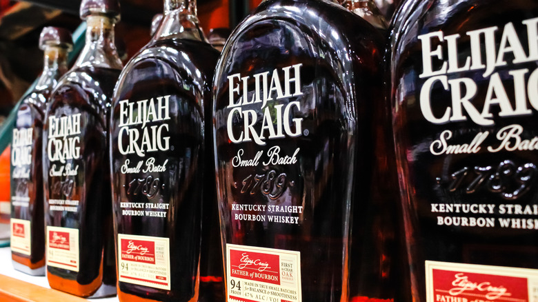 A row of Elijah Craig Small Batch bottles showcased on a shelf