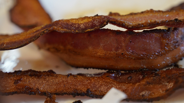 Closeup of three pieces of crispy cooked Waffle House Bacon