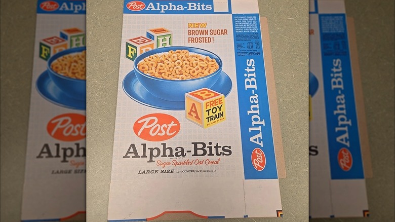 Vintage flattened Alpha-Bits cereal box on surface, mirrored image
