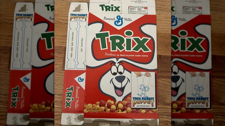 Flattened 1960s Trix Cereal box on wooden table, mirrored image