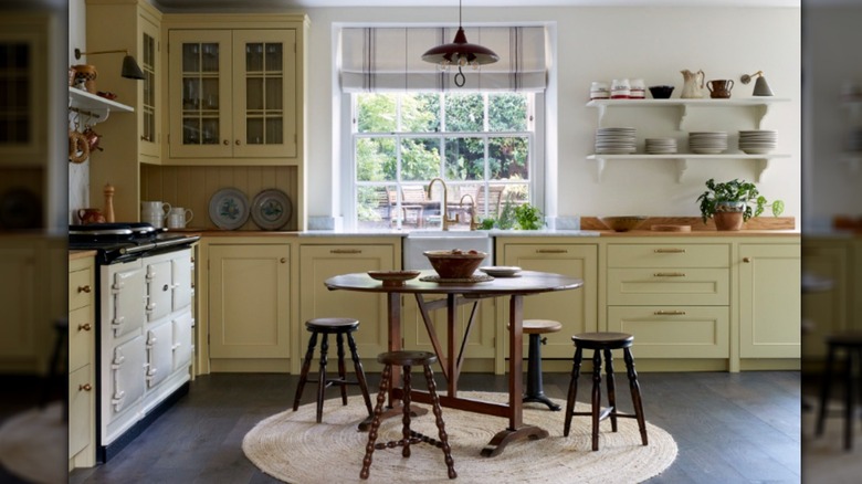 A bistro-inspired kitchen with butter-yellow cabinets