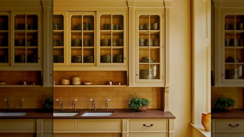 A kitchen with a butter-yellow backsplash