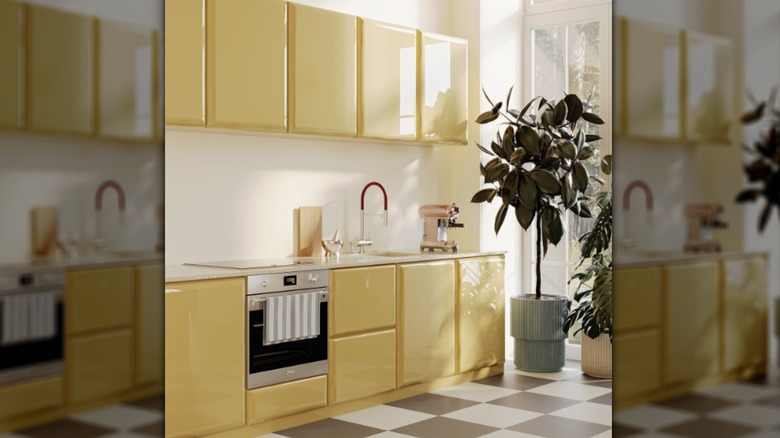 A kitchen with retro cabinets in butter-yellow