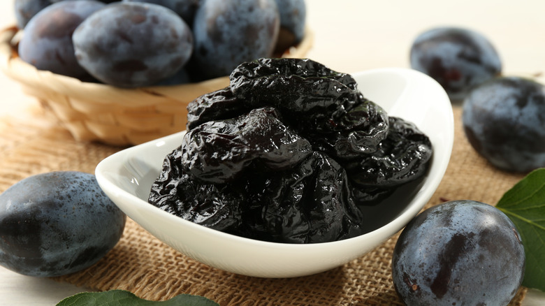 White bowl with prunes