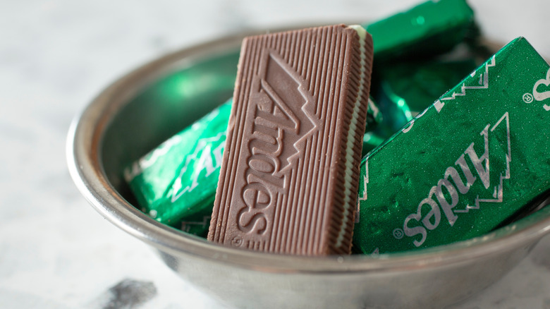 A view of a small bowl of Andes mint chocolates