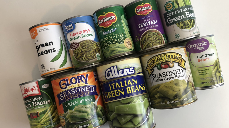 10 different cans of green beans from different brands.