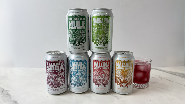 cans of South Norte tequila cocktails and glass with cocktail