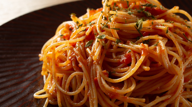 Angel hair pasta with red marinara on a plate