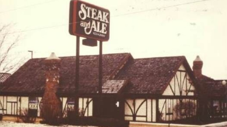 Old grainy photo of Steak and Ale in front of empty parking lot