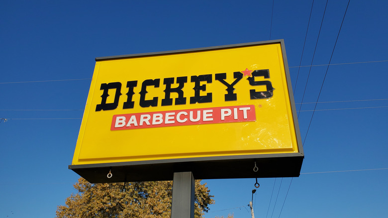 Dickey's BBQ Pit sign against blue sky