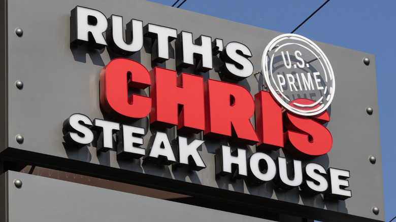 Ruth's Chris Steak House sign against blue sky