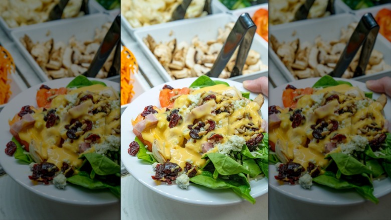 Making a salad at Golden Corral's salad bar