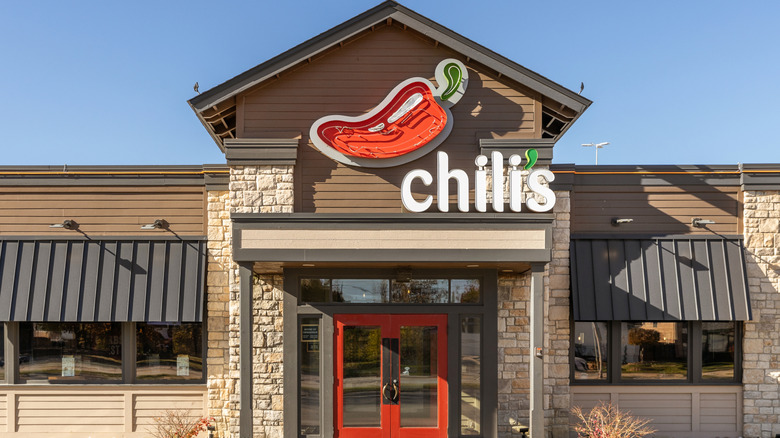 The front entrance of a Chili's restaurant, with the name and logo above the door