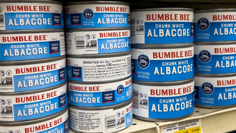 several cans of Bumble Bee tuna on a grocery store shelf