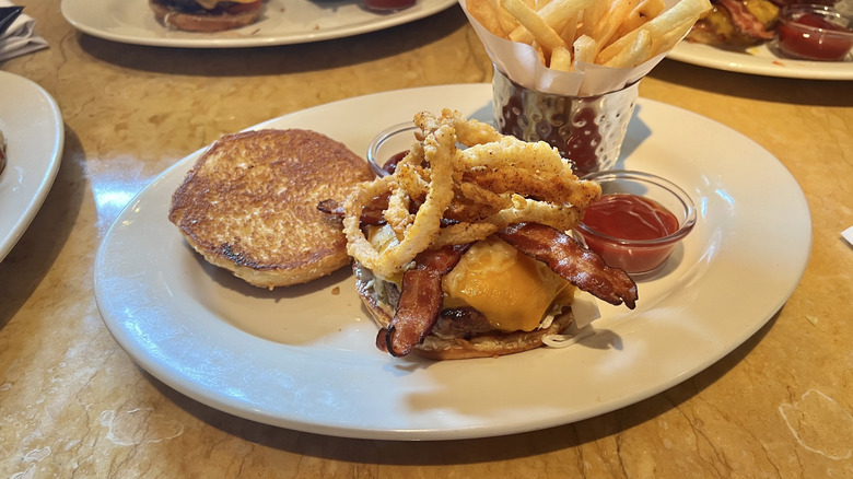 Cheesecake Factory Smokehouse B.B.Q. Burger and fries on plate.