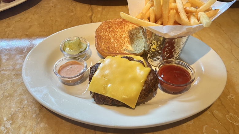 Cheesecake Factory Double Smash Cheeseburger and fries on plate.