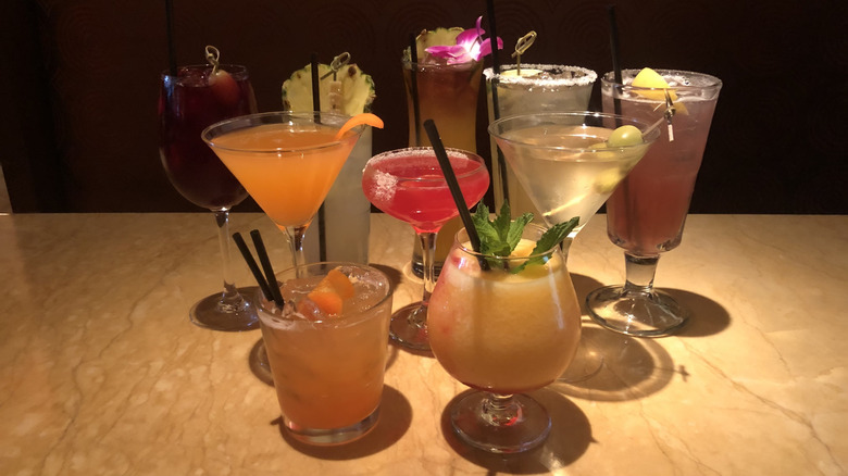 10 specialty cocktails from Cheesecake Factory on table.