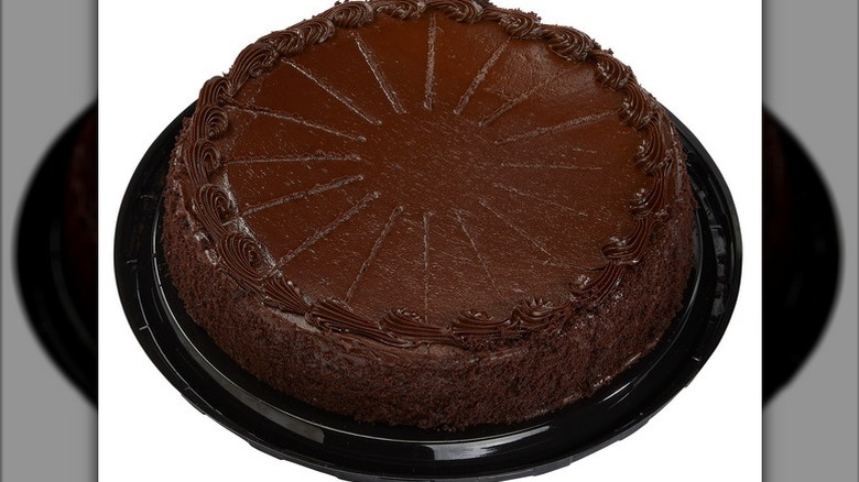 Chocolate cake filled with chocolate mousse on a white background