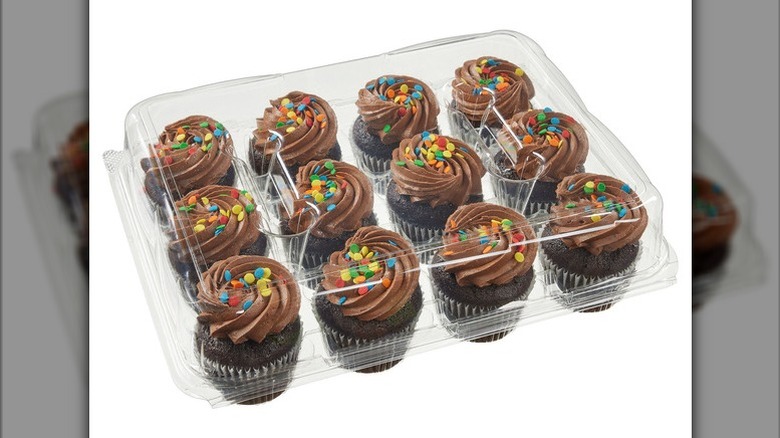 Chocolate cupcakes with chocolate buttercream on a white background