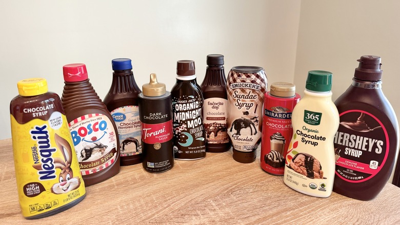 Chocolate syrup bottles on table