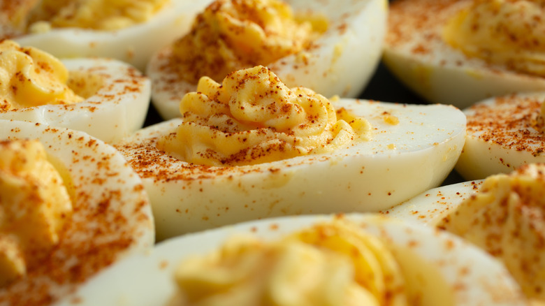 A close up of a plate of deviled eggs