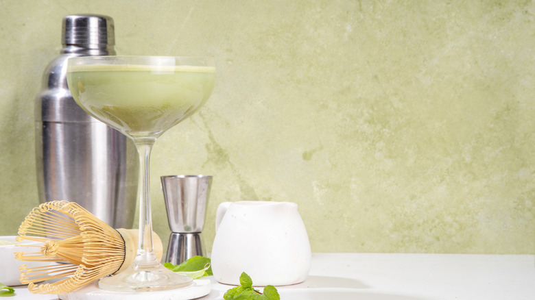 Green cocktail with shaker