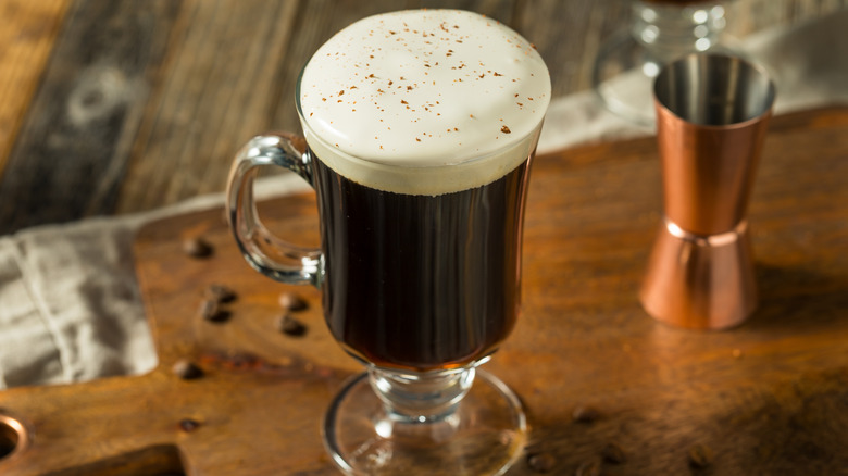 Warm Boozy Irish Coffee with Whipped Cream and Whiskey.