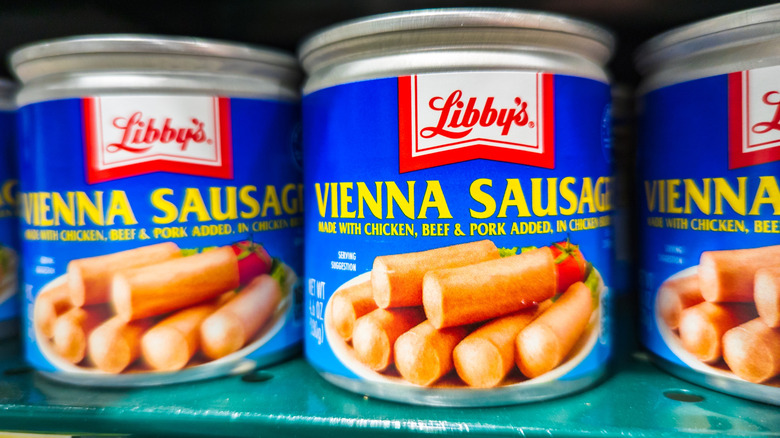 Cans Of Libbys Vienna Sausages Displayed On Grocery Store Shelf