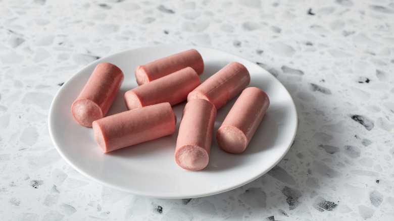 a plate of Vienna sausages on kitchen counter