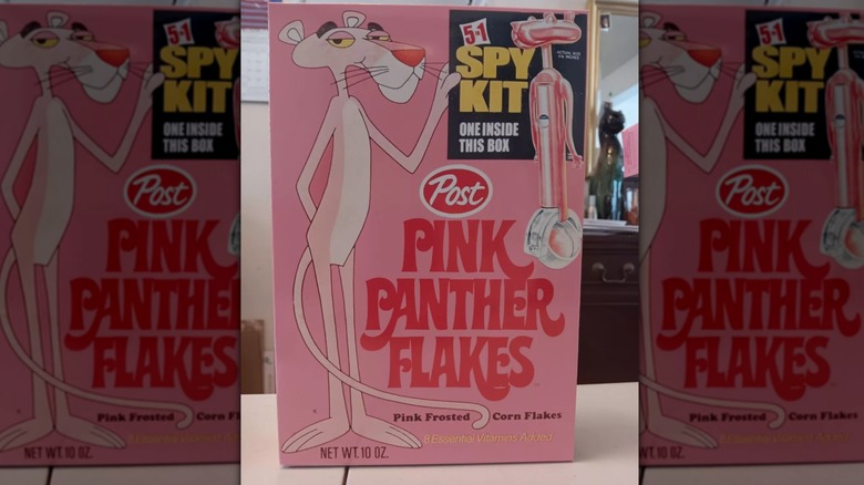 Mirrored image of box of Pink Panther Flakes on white table with mirror in he background