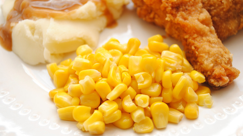 KFC chicken with corn, mashed potatoes and gravy.