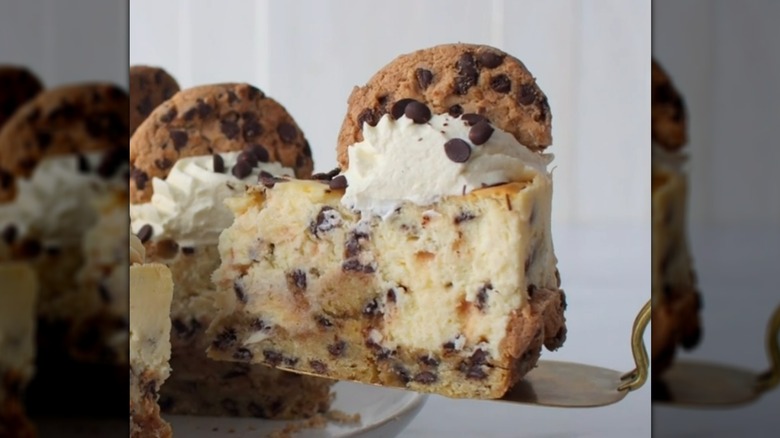 Lifting slice of chocolate chip cookie cheesecake
