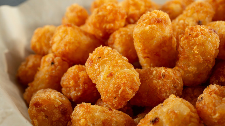 close up of tater tots in a basket