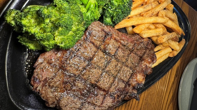 Plate with steak, broccoli, and French fries