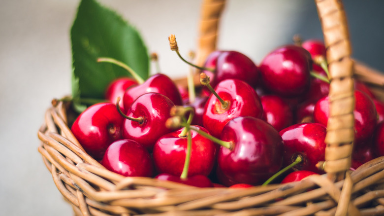 Red cherries in a wicker basket