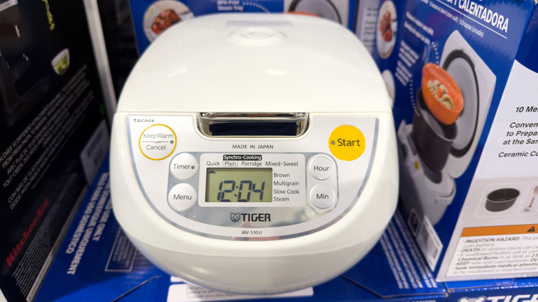 White rice cooker with different buttons for settings