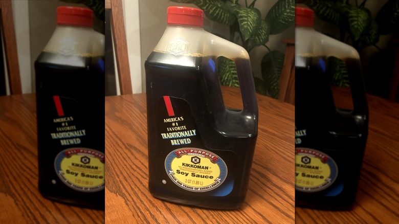 Bottle of Kikkoman Soy Sauce next to chopsticks